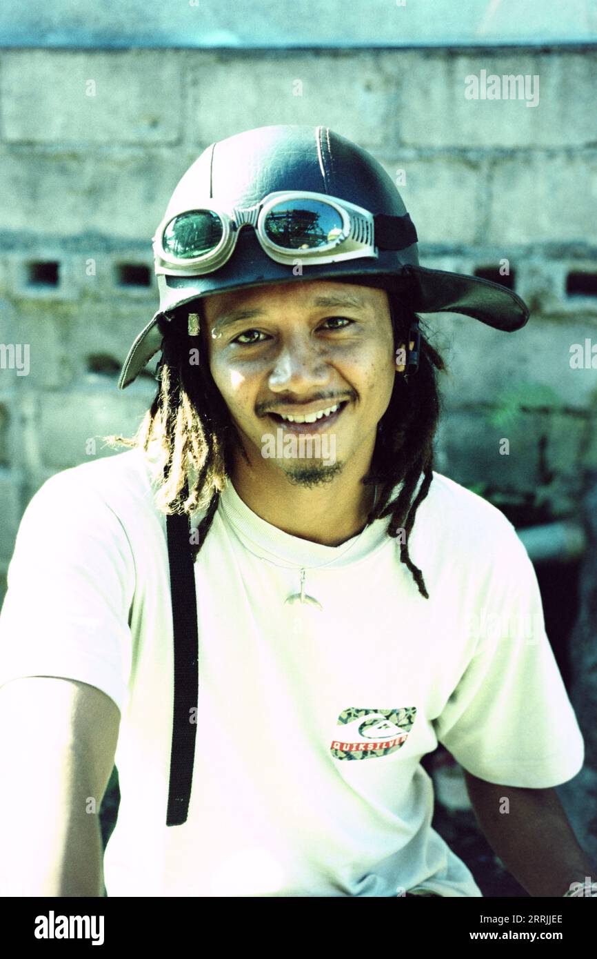 Portrait of a young Balinese surfer wearing a helmet Stock Photo