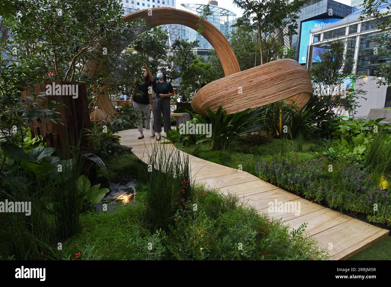 220729 -- SINGAPORE, July 29, 2022 -- People view the participating works of the Show Garden competition, as part of the media preview of the Singapore Garden Festival in Singapore on July 29, 2022. The Singapore Garden Festival will be held from July 30 to Aug. 7.  SINGAPORE-GARDEN FESTIVAL ThenxChihxWey PUBLICATIONxNOTxINxCHN Stock Photo