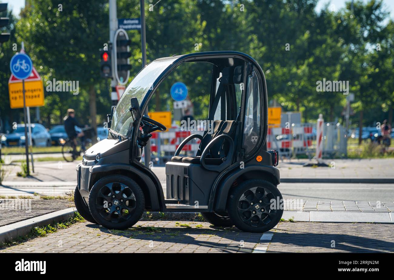 Amsterdam, The Netherlands, 06.09.2023, Doorless electric two-seat micro car Birò Estrima parked in the street Stock Photo