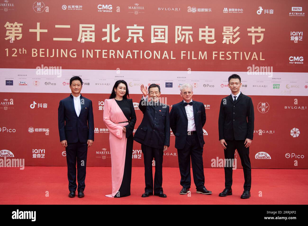 220813 -- BEIJING, Aug. 13, 2022 -- Jury members of Tiantan Awards Li Xuejian C, Guo Fan 1st R, Malcolm Clarke 2nd R, Qin Hailu 2nd L and Wu Jing pose for a group photo on the red carpet of the 12th Beijing International Film Festival in Beijing, capital of China, Aug. 12, 2022.  CHINA-BEIJING-INTERNATIONAL FILM FESTIVAL-RED CARPET CN ChenxZhonghao PUBLICATIONxNOTxINxCHN Stock Photo