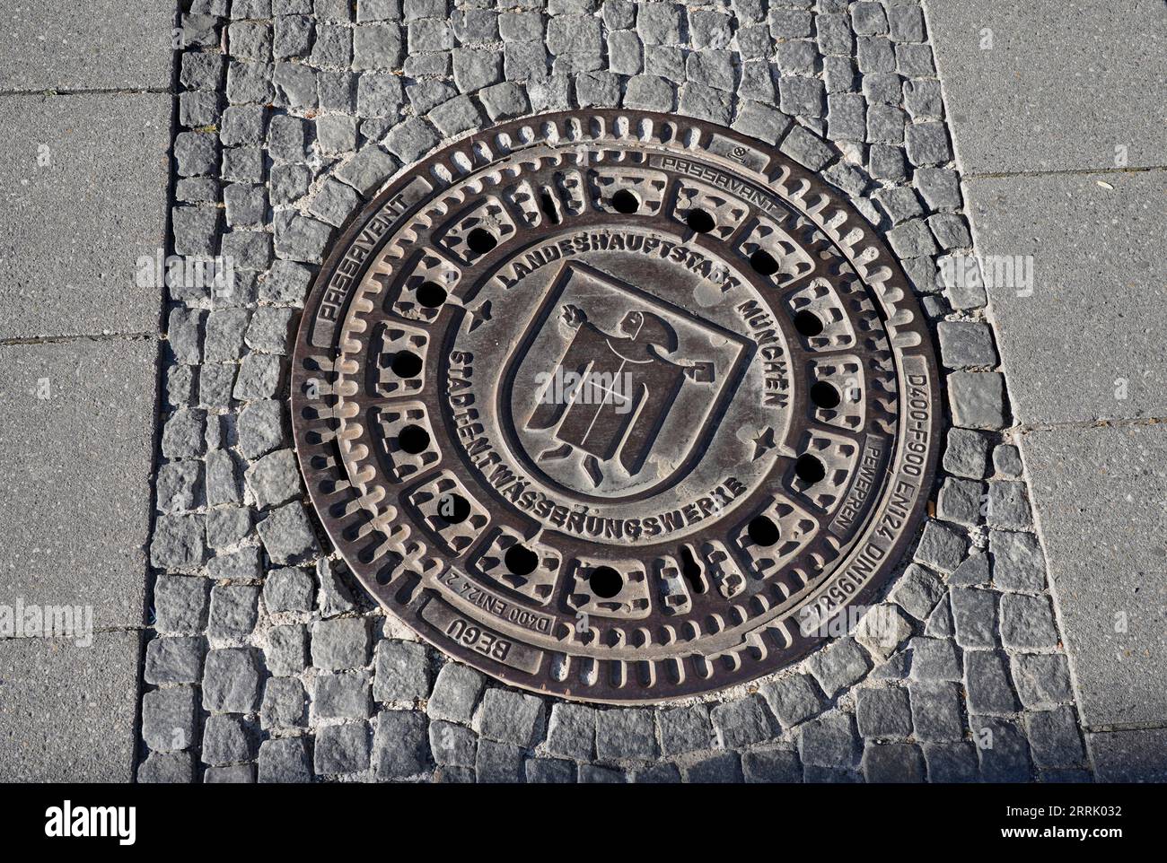 Germany, Bavaria, Munich, pedestrian zone, manhole cover with Munich city coat of arms Stock Photo