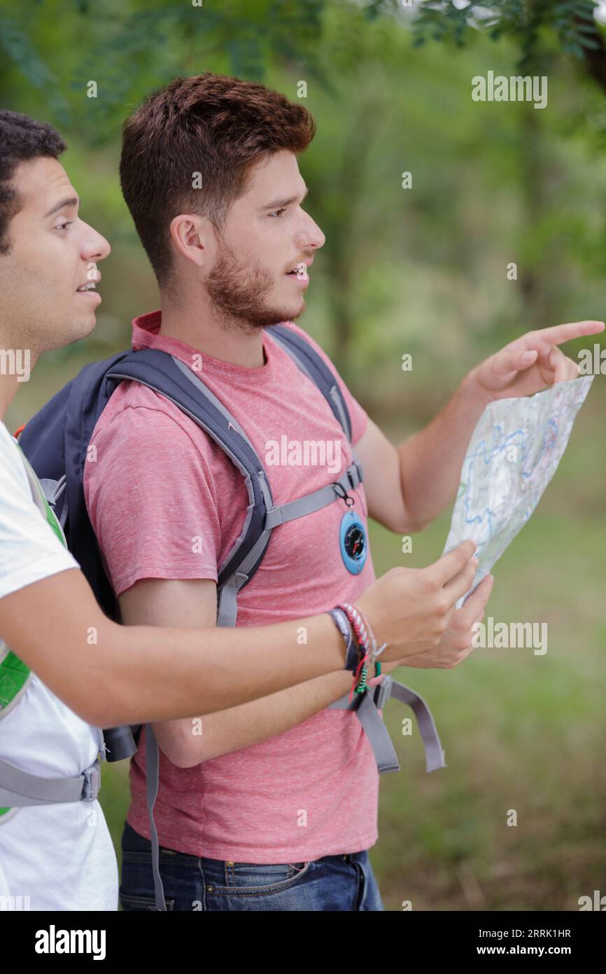 Two hikers looking at a map hi-res stock photography and images - Alamy