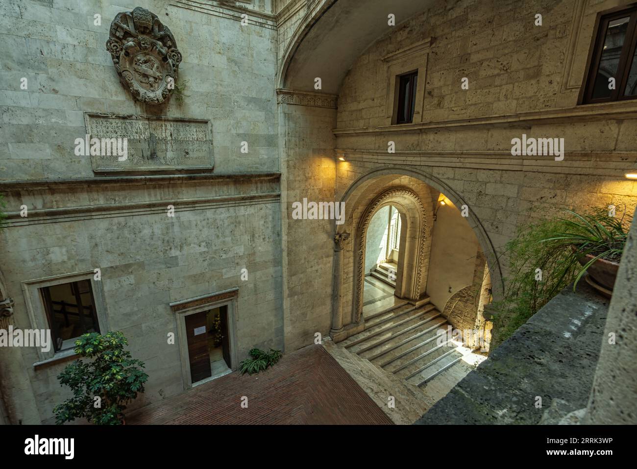 The Renaissance-style internal courtyard, with 3 orders of loggias supported by elegant travertine columns, of Palazzo dei Capitani del Popolo.Marche Stock Photo
