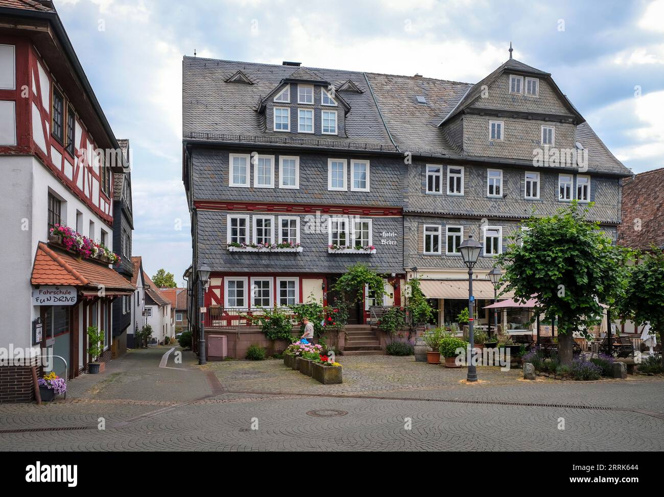 Amöneburg, Hesse, Germany - Old Town. Hotel Weber at the historical market place. Amöneburg is a small town in the central Hessian district of Marburg-Biedenkopf. It is located on the 365 m high mountain Amöneburg with the castle Amöneburg at the top. Stock Photo