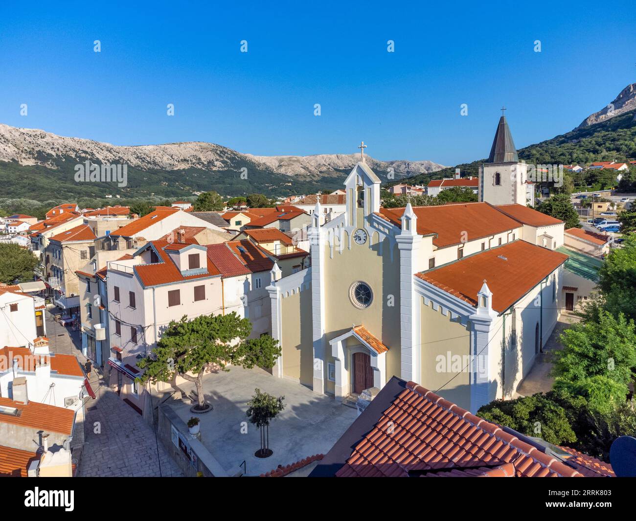 Croatia, Kvarner bay, Primorje Gorski Kotar County, island of Krk, elevated view of Baska with details on the church of the Holy Trinity Stock Photo