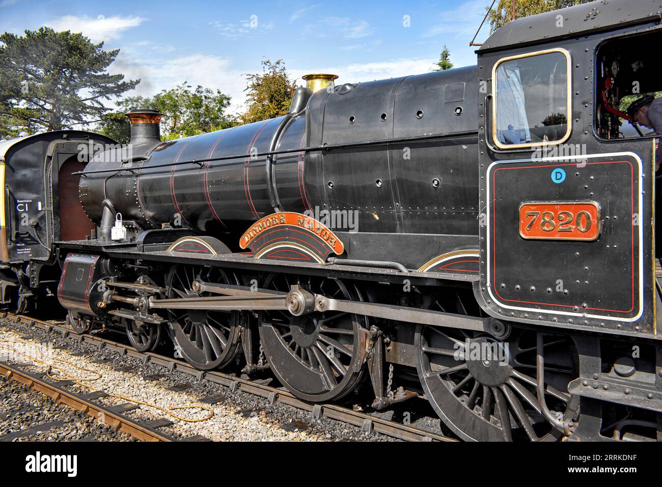 Steam train UK arriving at the GWR preserved train station Winchcombe Gloucestershire England. No 7820 Dinmore Manor Stock Photo