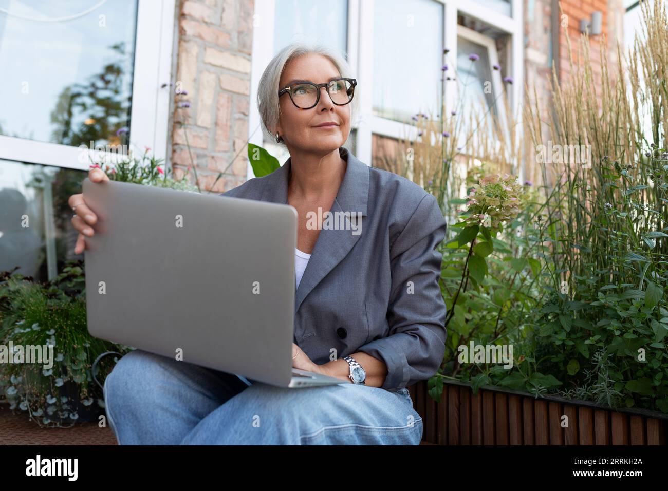 Old lady sitting on porch hi-res stock photography and images - Alamy