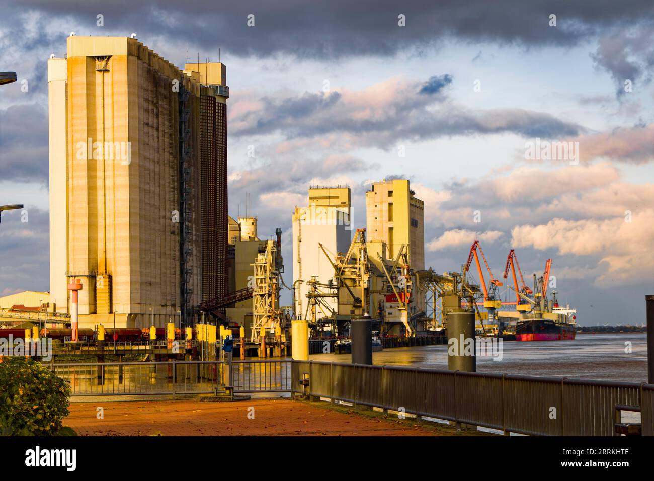 Port facilities, silos and cargo ship in the Weser port of Brake Stock Photo