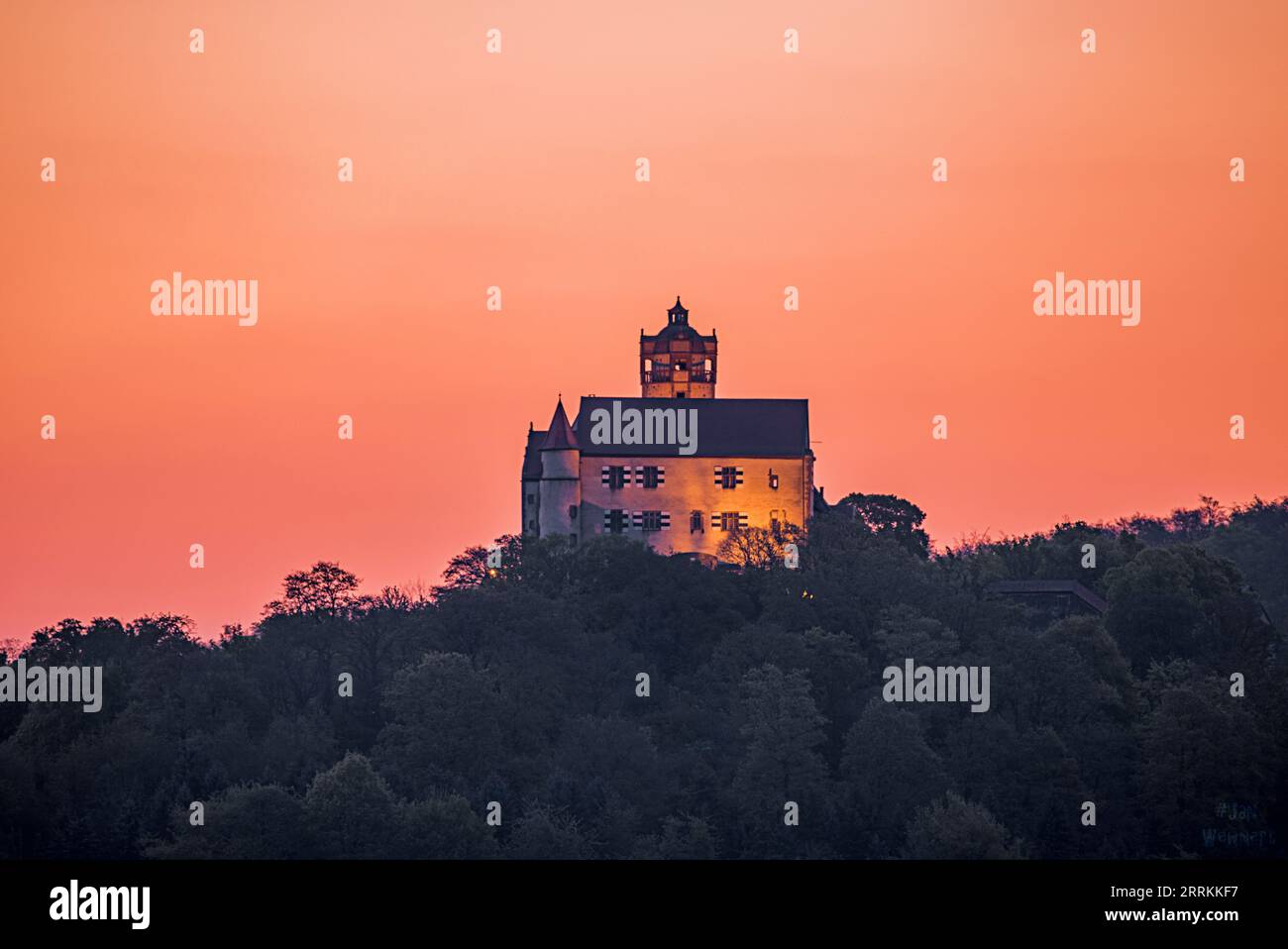 A beautiful landscape shot in the countryside, old knight castle - Ronneburg with agriculture and fields in the sunset, Hesse, Germany, Europe Stock Photo