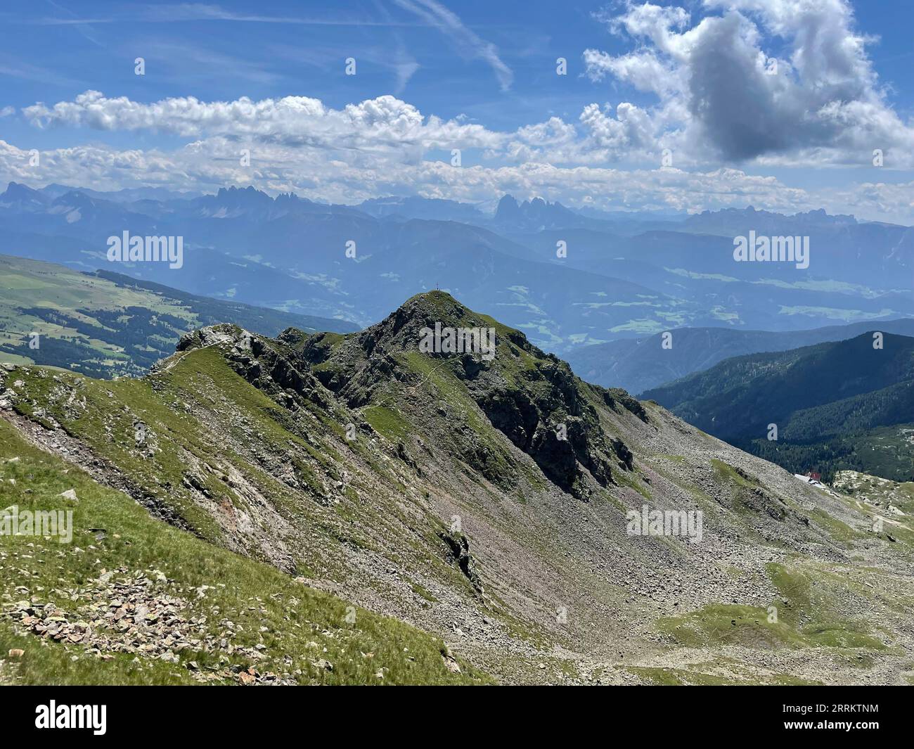 Valley view, peak of Ritzlar, hike to Latzfons Cross in South Tyrol, pilgrimage site, Sarntal Alps, 2300 m, viewpoint, Dolomites, Klausen, Latzfons, Wipptal, sun, mountains, clouds, nature, activity, Klausen, South Tyrol, Alto Adige, Italy Stock Photo