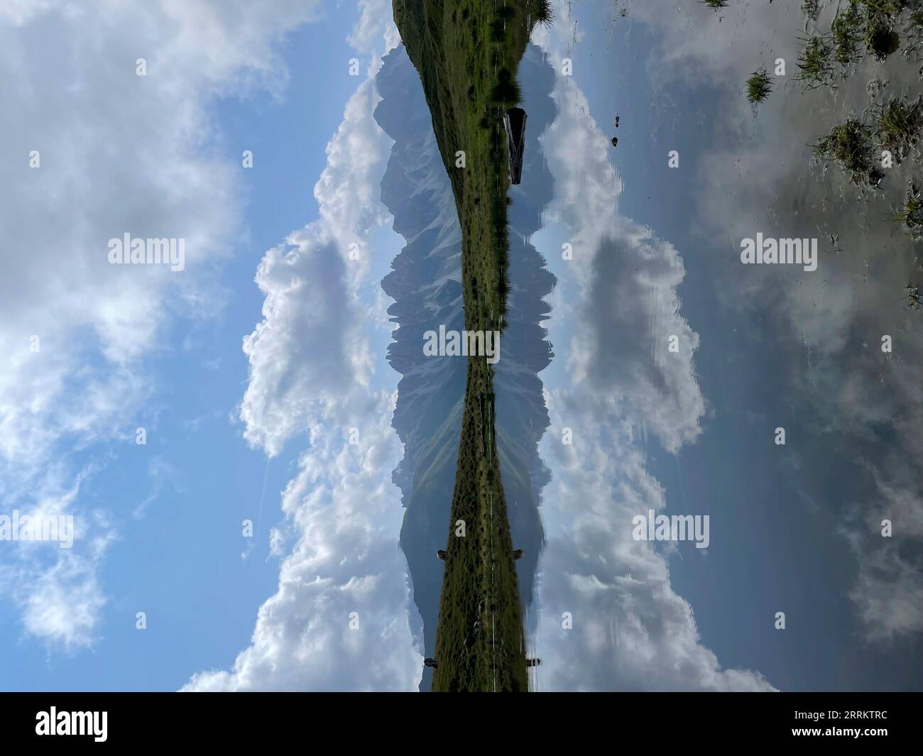 Hike to Salfainssee and Grieskogel, reflection Kalkkögel, Senderstal, Kemater Alm, Stubai Alps, reflection, mountain tour, viewpoint, sun, mountains, clouds, nature, activity, Innsbruck, Grinzens, Tyrol, Austria Stock Photo