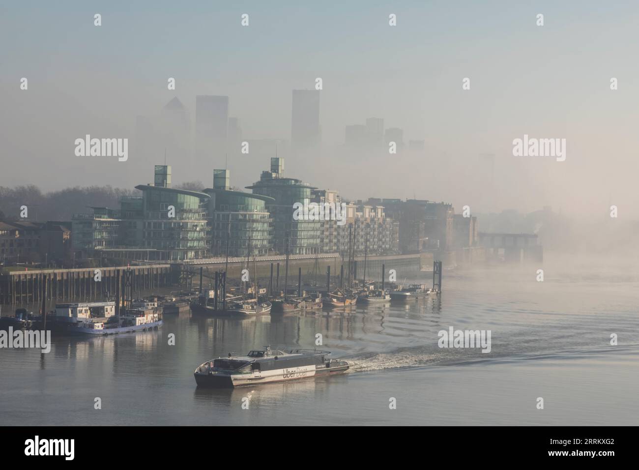 England, London, Docklands, River Thames and Canary Wharf Skyline in the Morning Mist Stock Photo