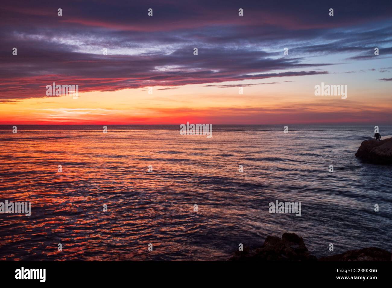 Sunset In October Figure in seascape hi-res stock photography and images - Alamy