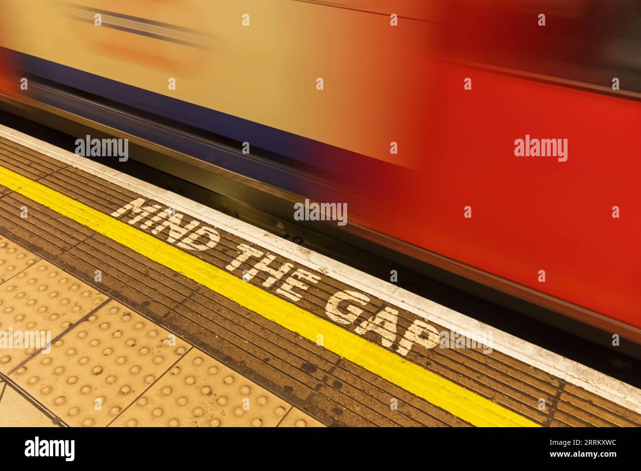 England, London, London Underground, Moving Train with Mind the Gap Sign Stock Photo