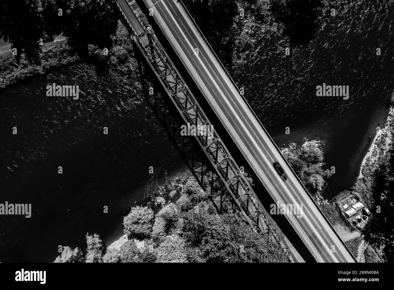 An aerial view of McKenzie River surrounded by lush green on a sunny