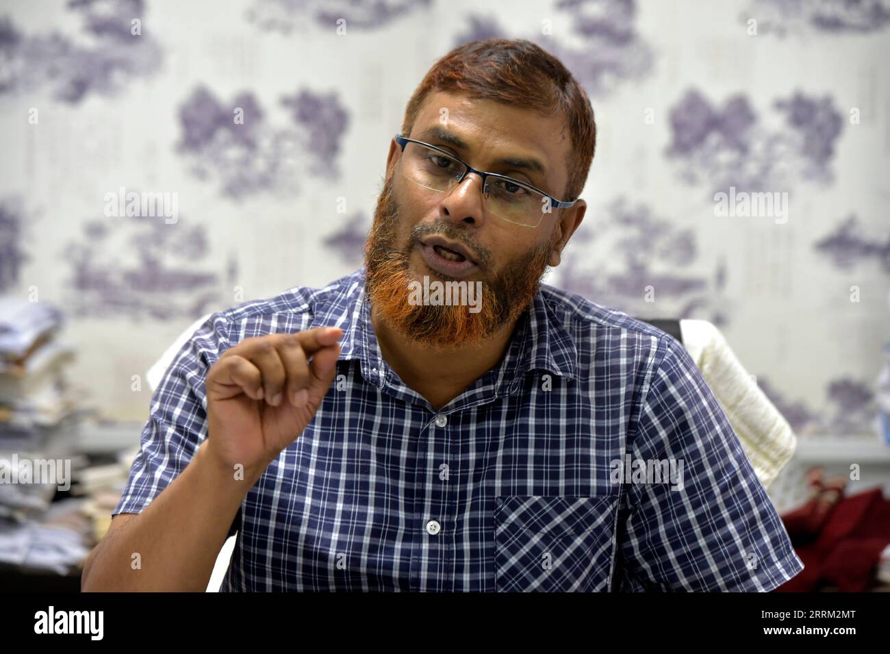 220928 -- DHAKA, Sept. 28, 2022 -- Md Afzal Hossain, the head of the Chinese Department at Dhaka University, speaks during an interview with Xinhua at his office in Dhaka, Bangladesh, Aug. 17, 2022. TO GO WITH Feature: Chinese language top choice for Bangladeshi students in top university BANGLADESH-DHAKA-CHINESE-LANGUAGE Salim PUBLICATIONxNOTxINxCHN Stock Photo