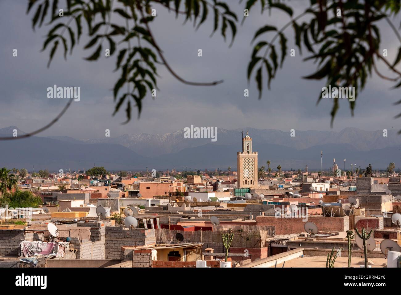 Scenic view of the Marrakech medina and the Atlas mountains in the background during stormy weather, Morocco Stock Photo