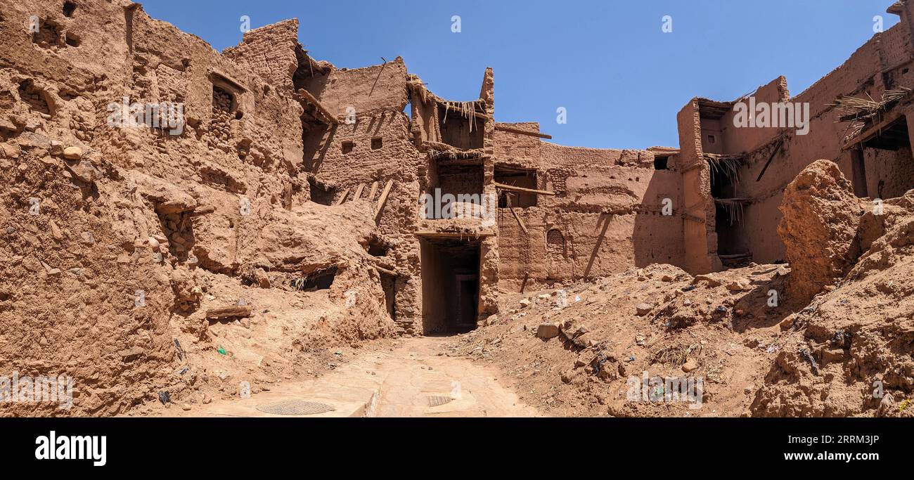 Old historic derelict clay houses in the city center of Amezrou in the Draa valley, Morocco Stock Photo