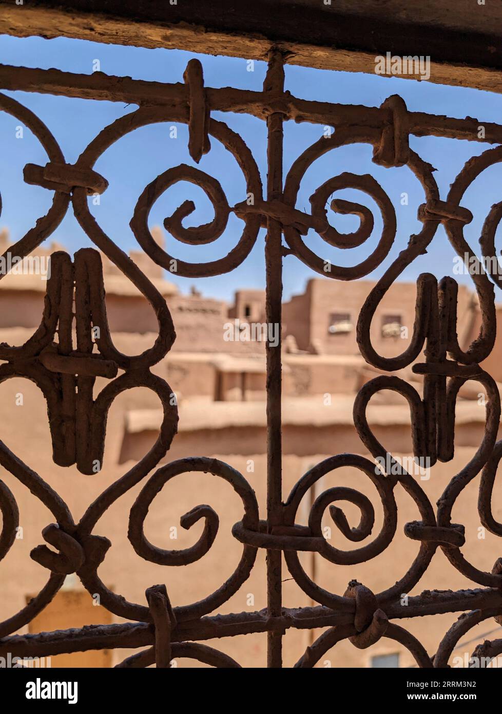Ornate traditional window grid of a berber house ruin in the city center of Amezrou, Morocco Stock Photo