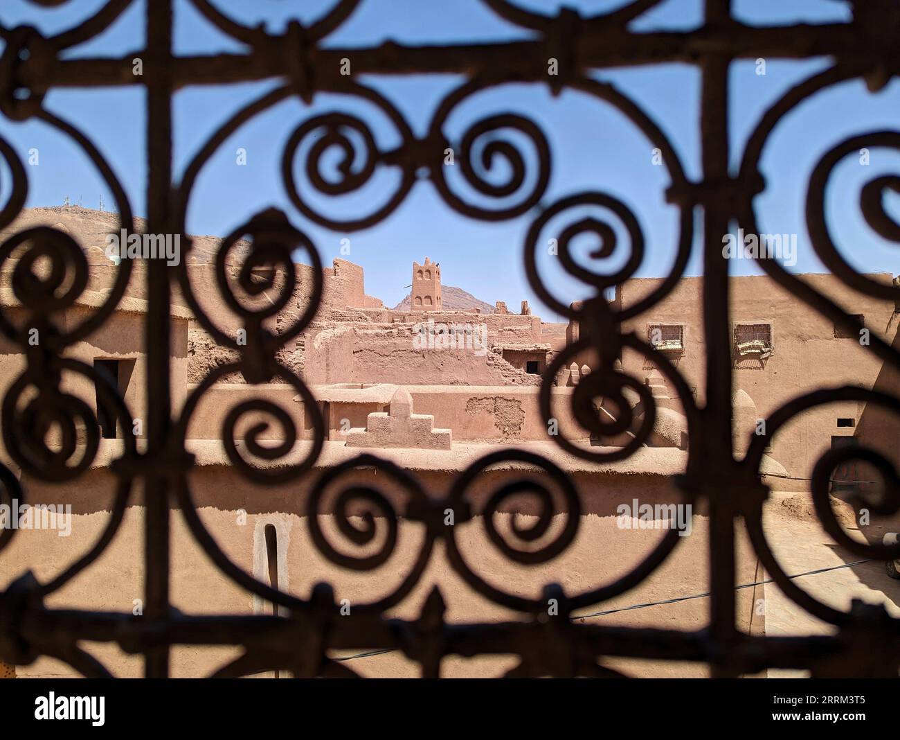 Ornate traditional window grid of a berber house ruin in the city center of Amezrou, Morocco Stock Photo