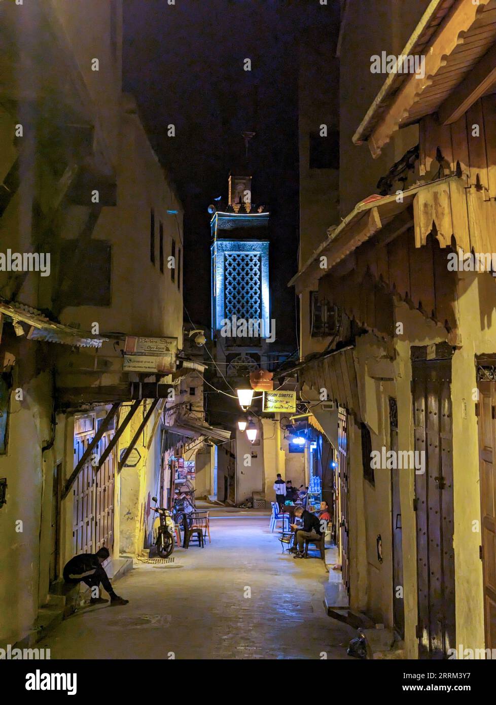 Scenic view from the minaret of mardasa Bou Inaniya in the medina of Fes, seen from a narrow alleyway, Morocco Stock Photo