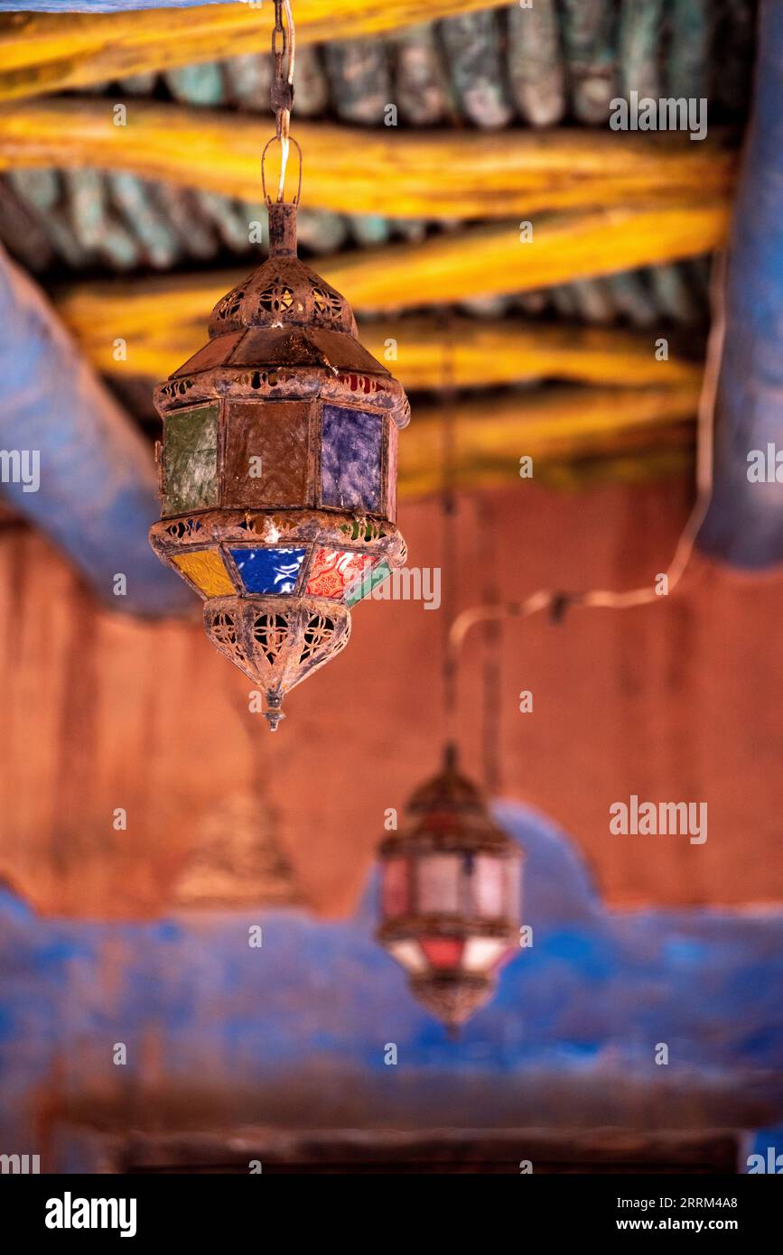 Old ancient Moroccan lantern hanging from a traditionally built wooden ceiling, Agadir in Morocco Stock Photo