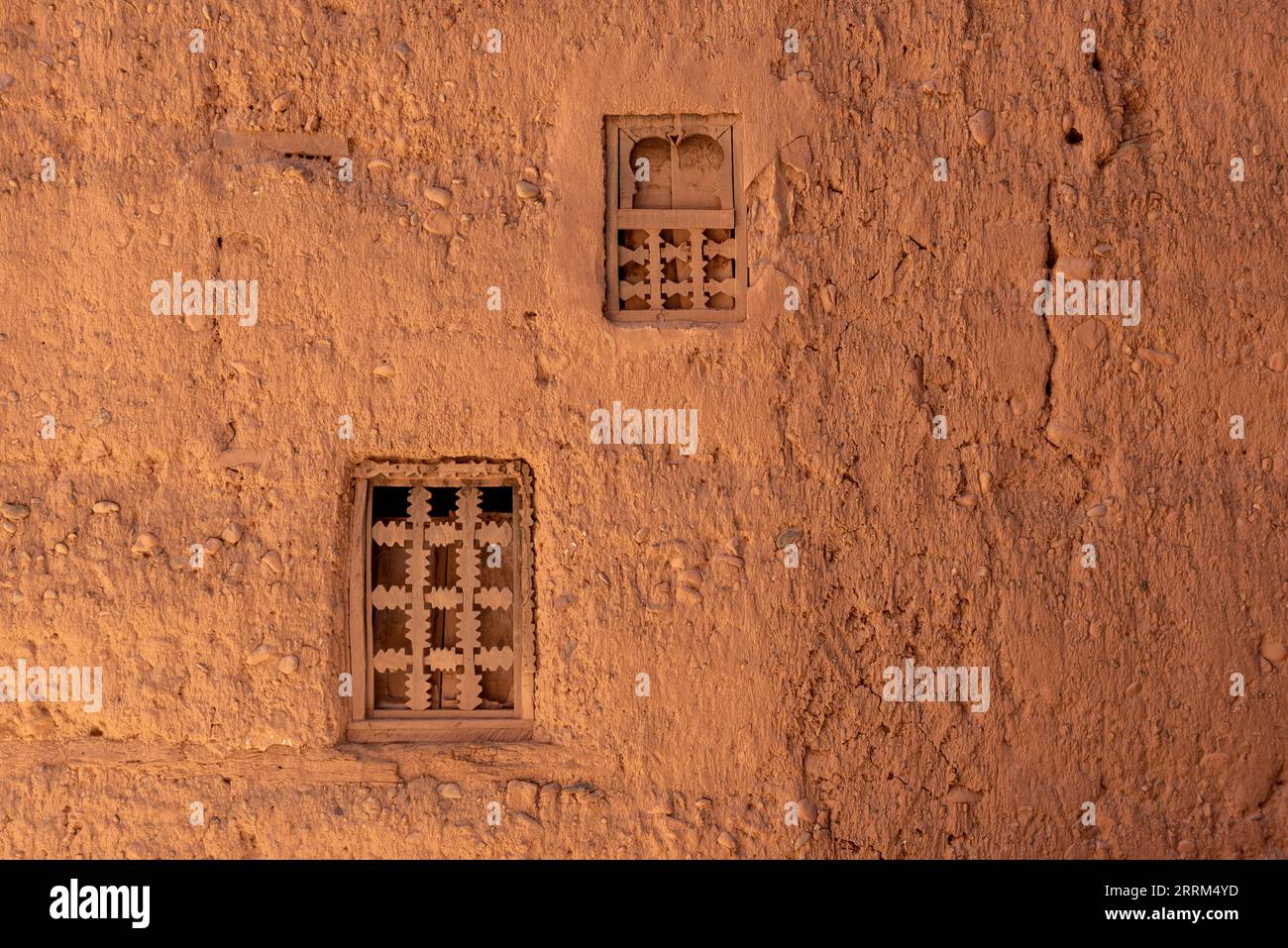 Two little windows in a typical berber house built of clay, Draa valley in Morocco Stock Photo
