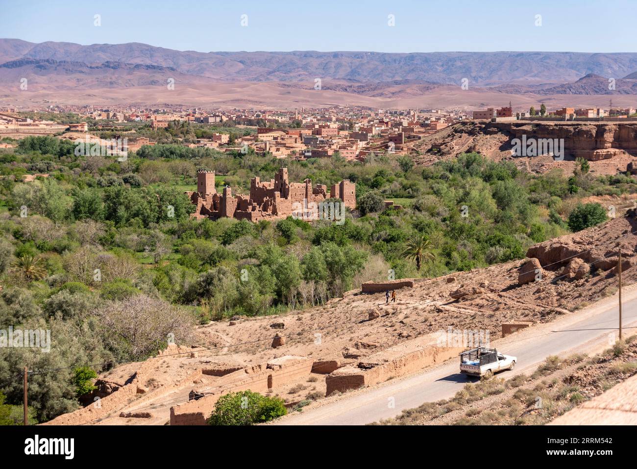 Old deserted big Kasbah on a hill surrounded by a palm grove in the valley of roses, Morocco Stock Photo