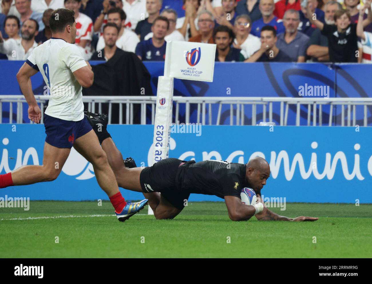New Zealand's Mark Telea scores his second try during the second half ...