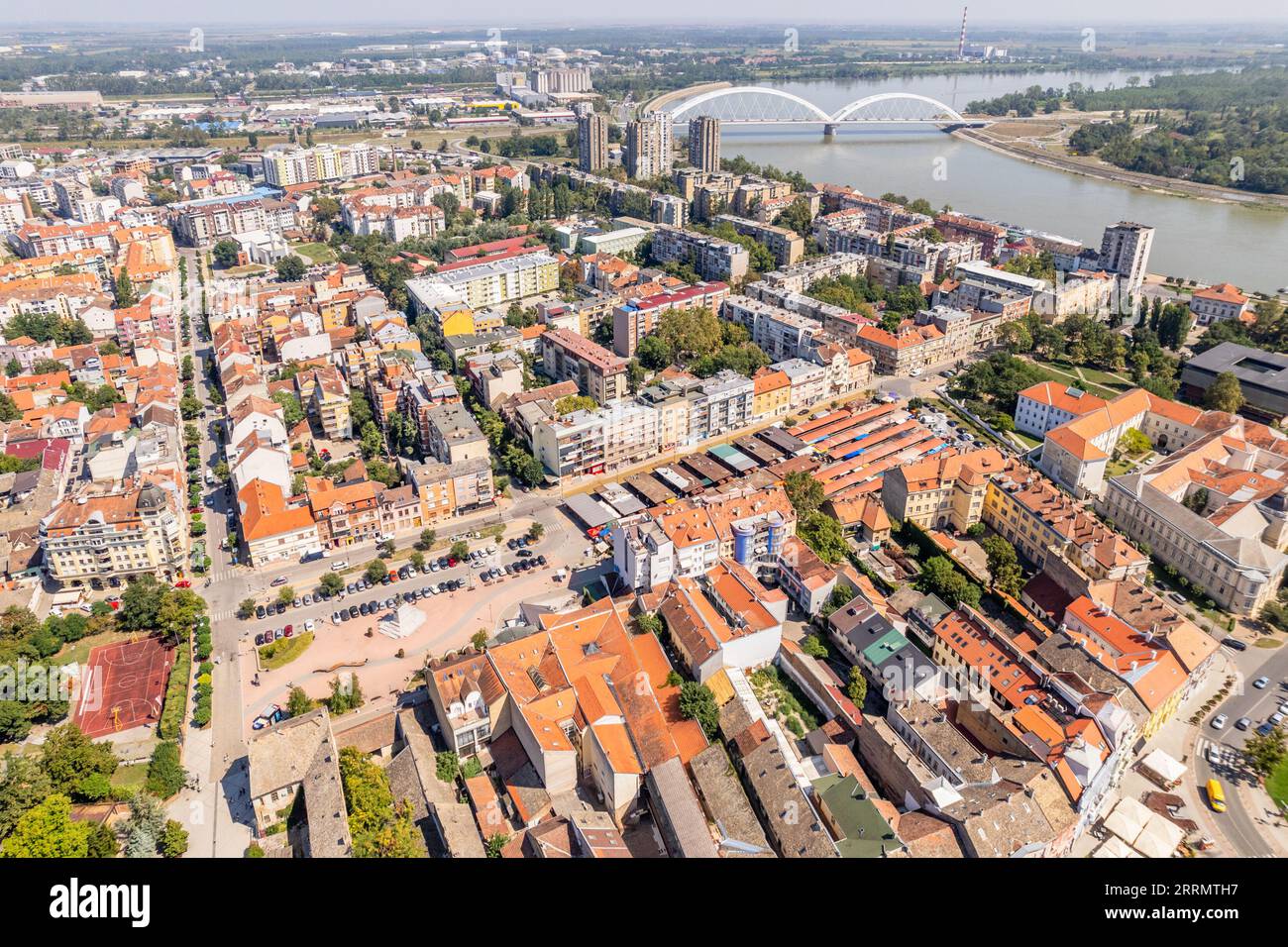 Aerial panorama of residential districts of Novi Sad with Danube river
