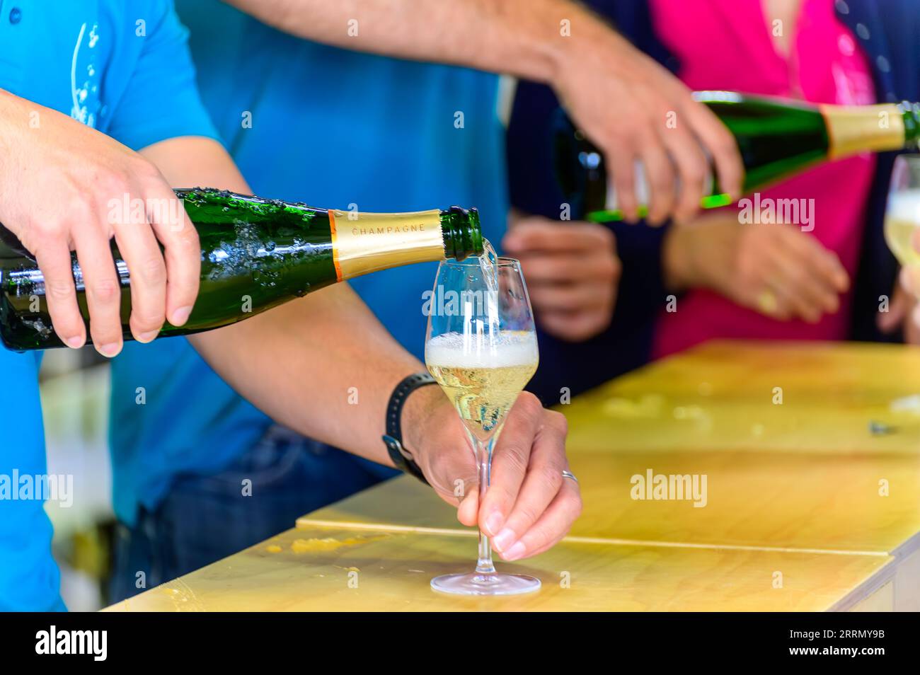 Tasting of sparkling white wine with bubbles champagne on summer
