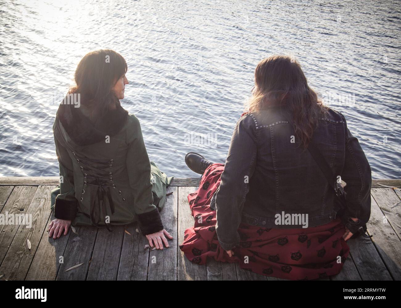 Two women sit waterfront hi-res stock photography and images - Alamy