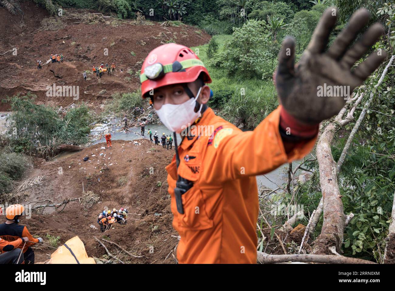 221125 -- CIANJUR, Nov. 25, 2022 -- A member of a joint search and rescue  team is pictured on a landslide scene in the wake of a 5.6-magnitude  earthquake in Cijedil village