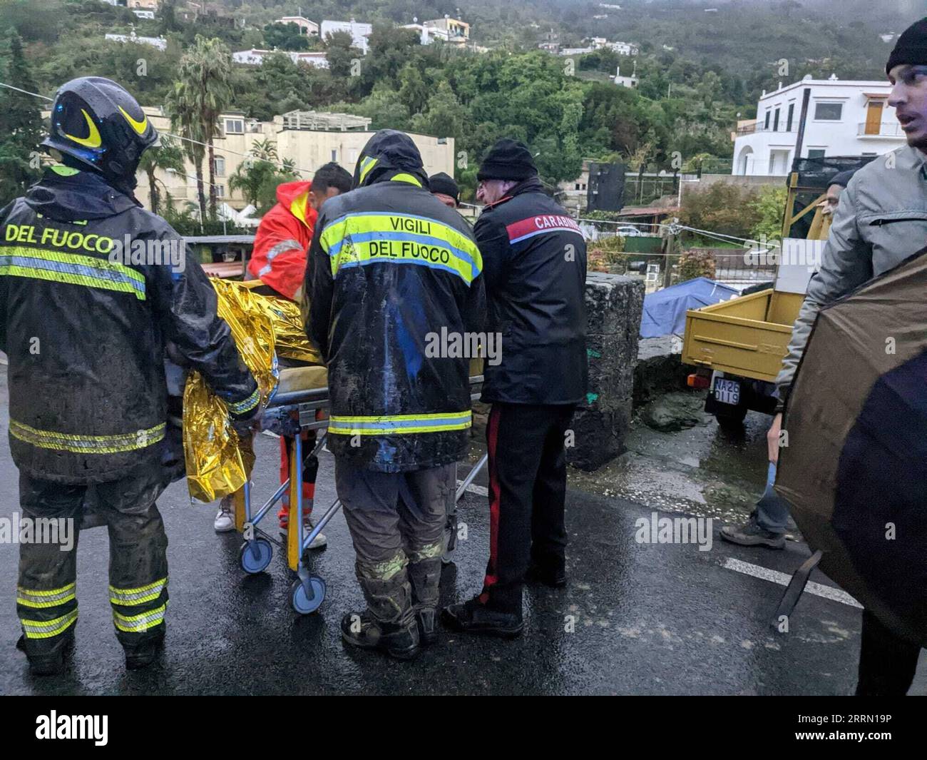221127 -- ROME, Nov. 27, 2022 -- Emergency staff members transfer an injured person after a landslide on the island of Ischia, Italy, Nov. 26, 2022. At least one person died and several others went missing in the island of Ischia in southern Italy on Saturday, after heavy rains triggered a landslide hitting several residential buildings, according to authorities and local media. Italian Carabinieri/Handout via Xinhua ITALY-ISCHIA ISLAND-LANDSLIDE JinxMamengni PUBLICATIONxNOTxINxCHN Stock Photo
