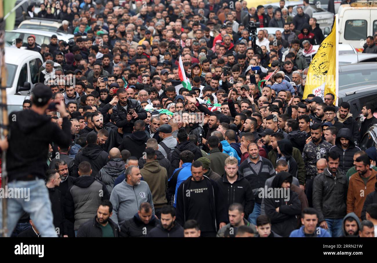 221129 -- BEIT RIMA, Nov. 29, 2022 -- People attend a funeral of ...