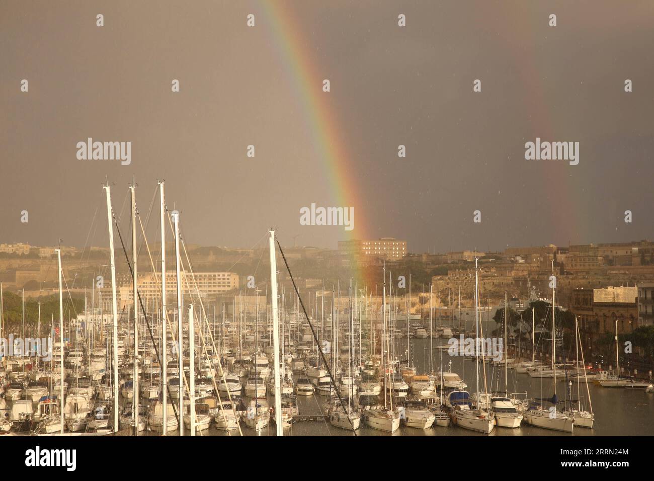 221130 -- TA XBIEX, Nov. 30, 2022 -- This photo taken on Nov. 29, 2022 shows a rainbow in the sky after a heavy rain in Ta Xbiex, Malta.  MALTA-TA XBIEX-RAINBOW ChenxWenxian PUBLICATIONxNOTxINxCHN Stock Photo