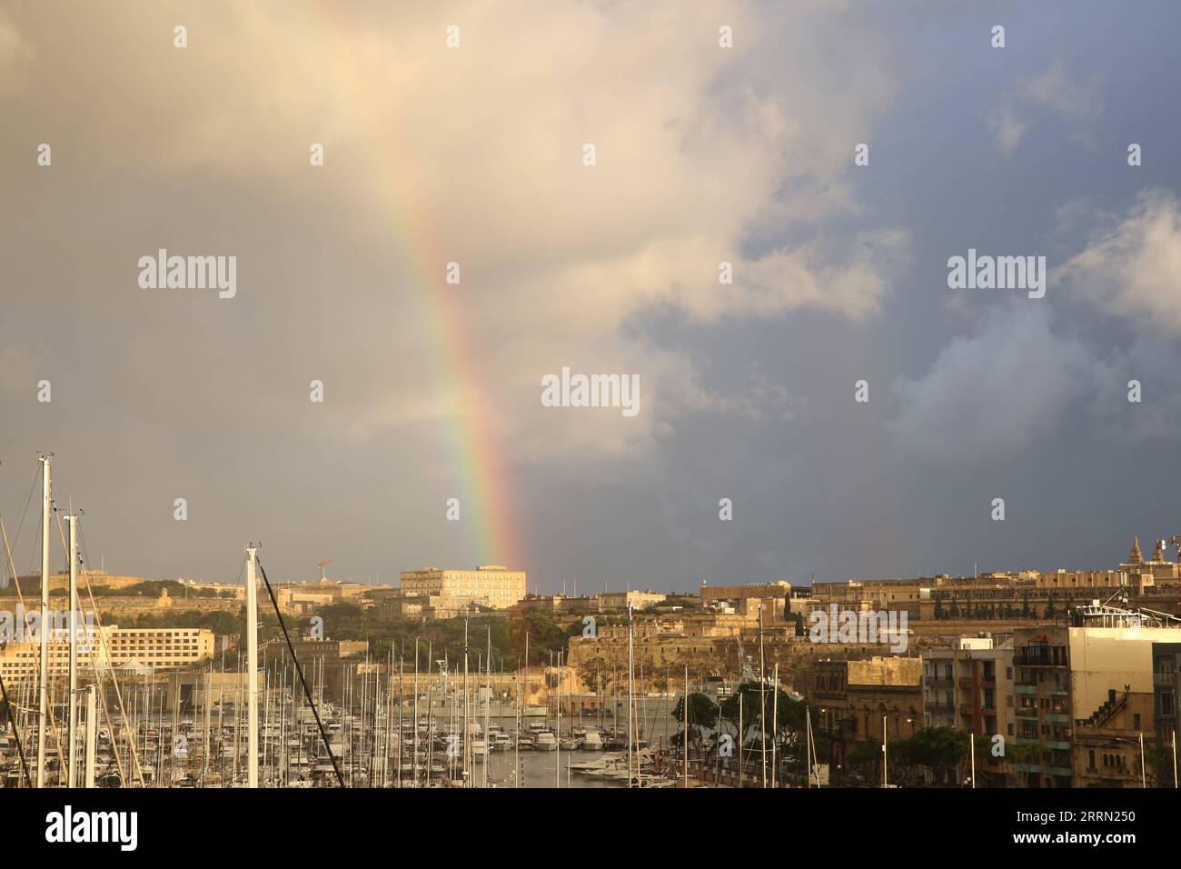 221130 -- TA XBIEX, Nov. 30, 2022 -- This photo taken on Nov. 29, 2022 shows a rainbow in the sky after a heavy rain in Ta Xbiex, Malta.  MALTA-TA XBIEX-RAINBOW ChenxWenxian PUBLICATIONxNOTxINxCHN Stock Photo