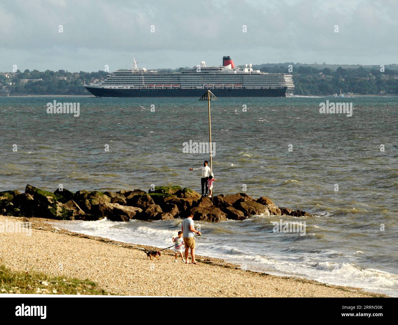 A CRIUSE SHIP PASSES THE BEACH  AT LEE ON THE SOLENT. PIC MIKE WALKER 2023 Stock Photo