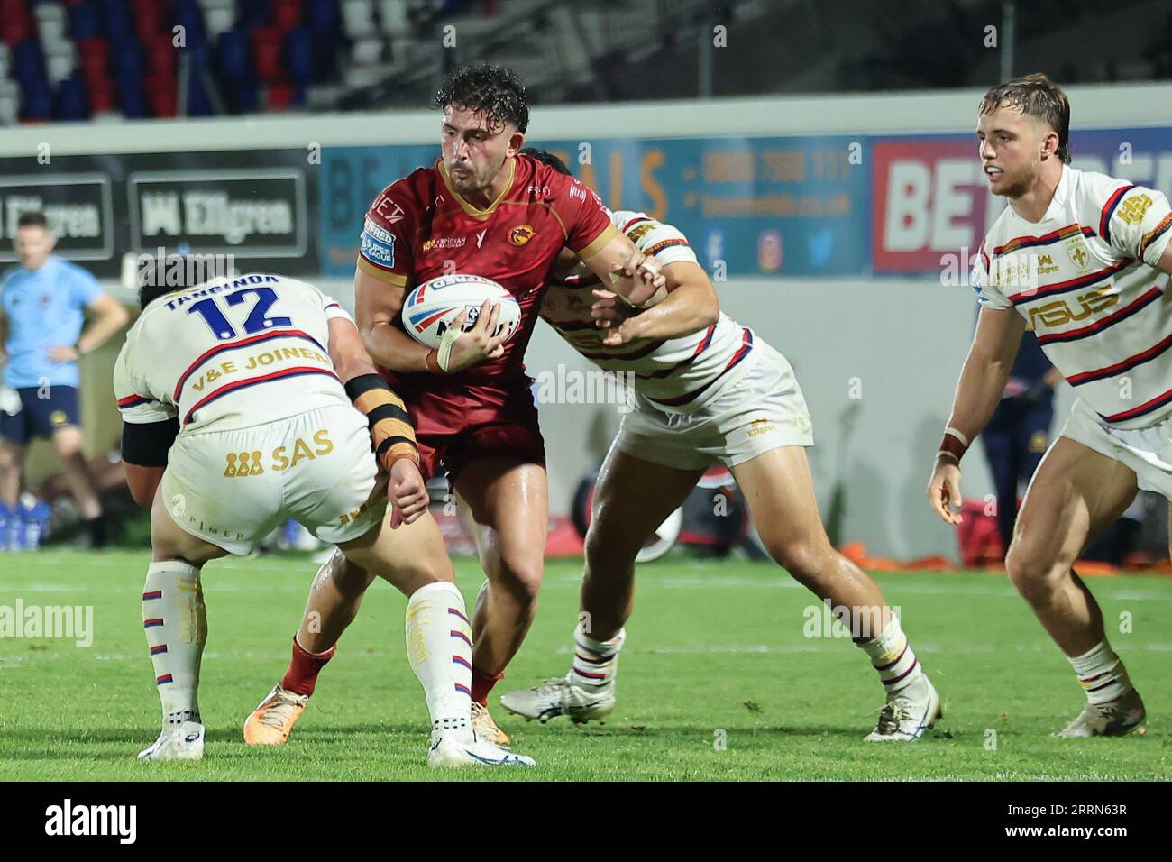 Wakefield, UK. 08th Sep, 2023. Be Well Support Stadium, Wakefield, West Yorkshire, 8th September 2023. Betfred Super League Wakefield Trinity vs Catalans Dragons Arthur Romano of Catalans Dragons tackled by Kelepi Tanginoa and Mason Lino of Wakefield Trinity Credit: Touchlinepics/Alamy Live News Stock Photo
