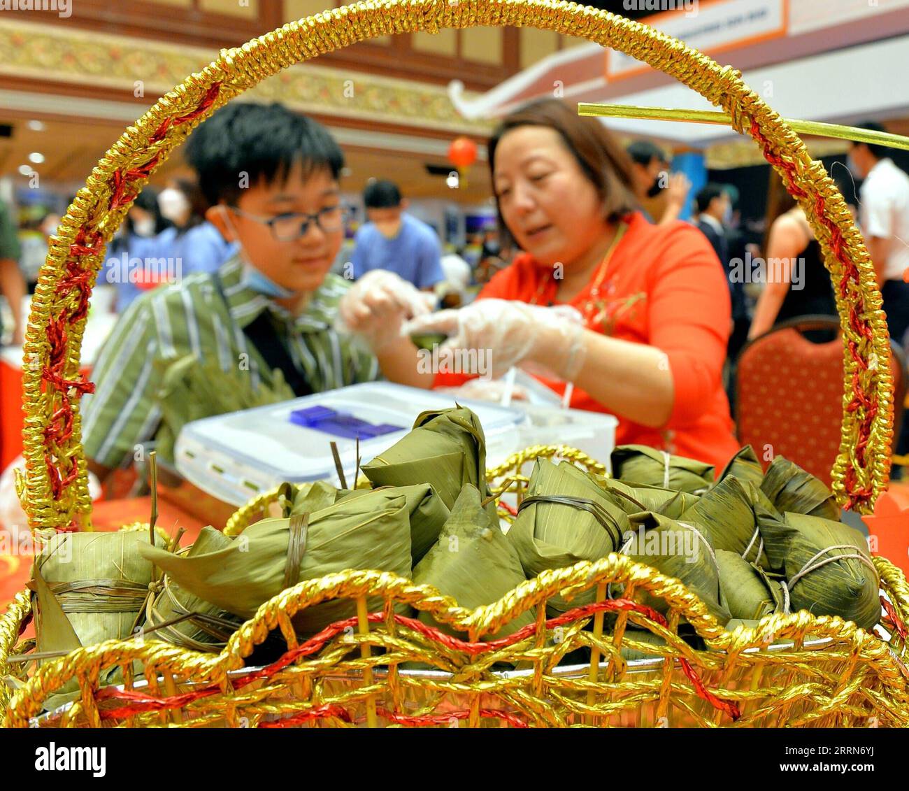 221216 -- BANDAR SERI BEGAWAN, Dec. 16, 2022 -- People make Zongzi, a