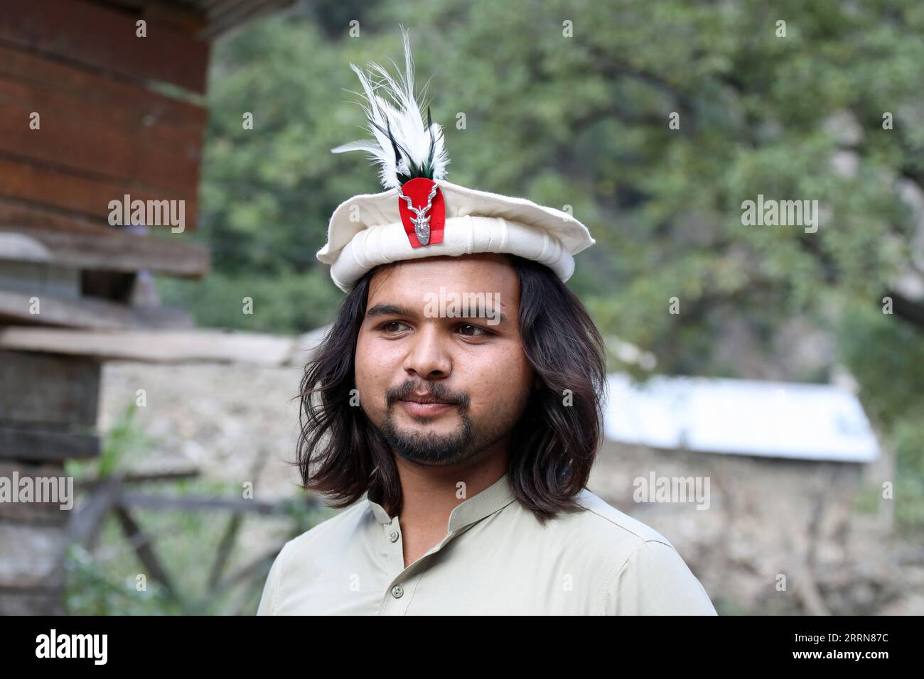 Chitrali man wearing a traditional hat made of wool in Pakistan Stock Photo