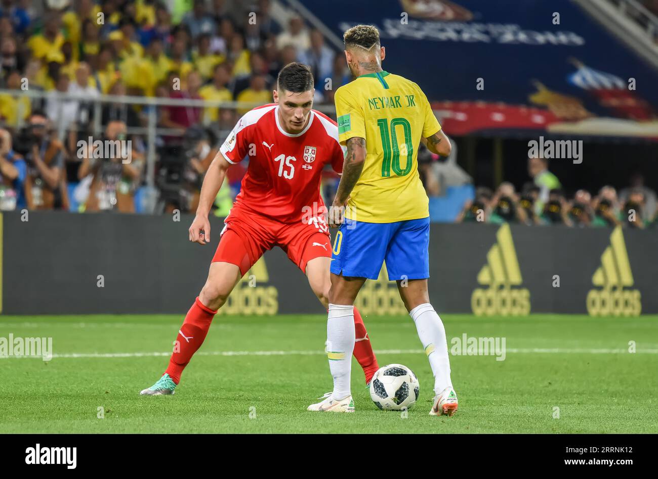 Moscow, Russia - June 27, 2018. Brazil national football team striker Neymar and Serbia player Nikola Milenkovic during FIFA World Cup 2018 match Serb Stock Photo