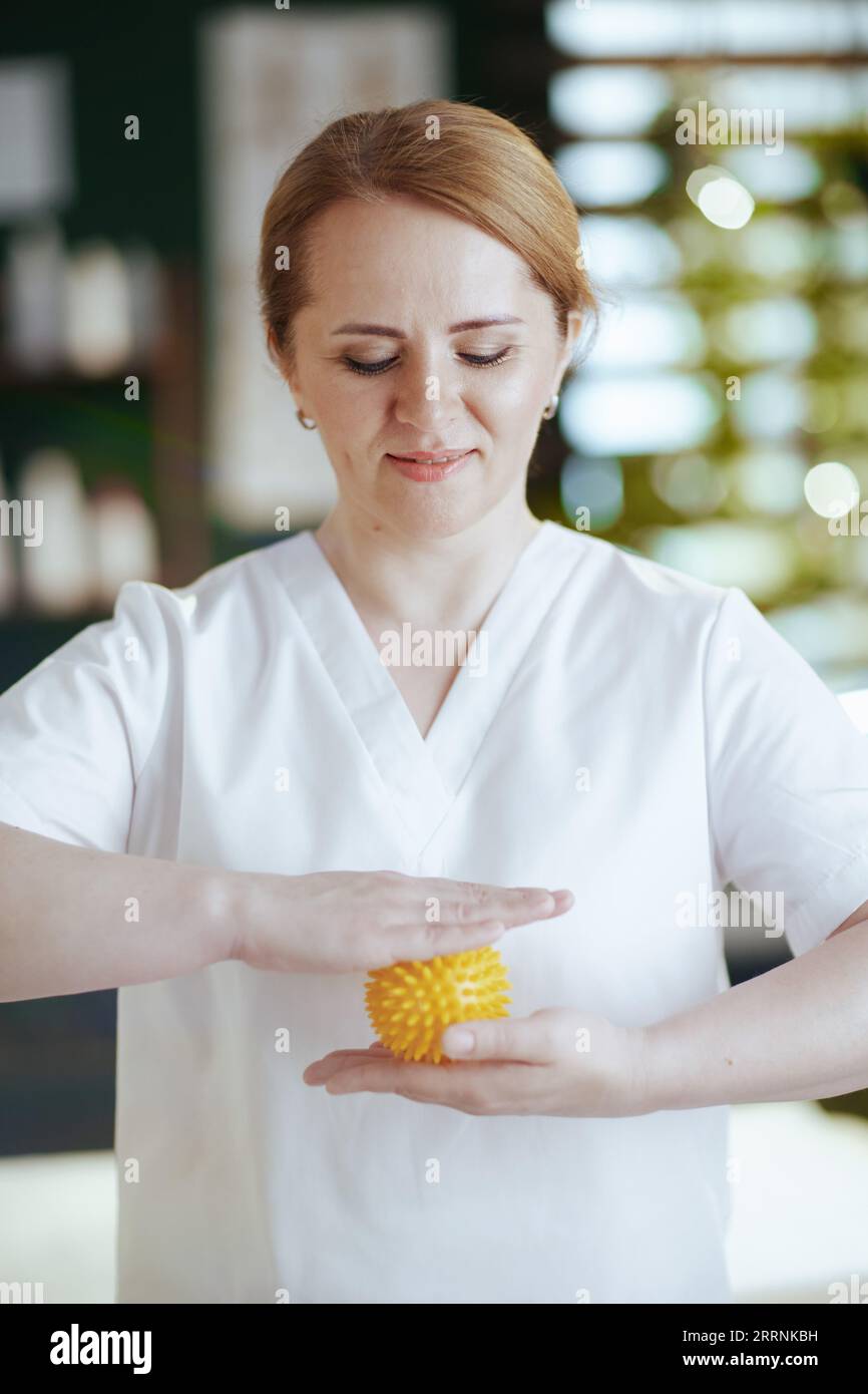 Healthcare time. massage therapist woman in spa salon with massage ball Stock Photo Alamy