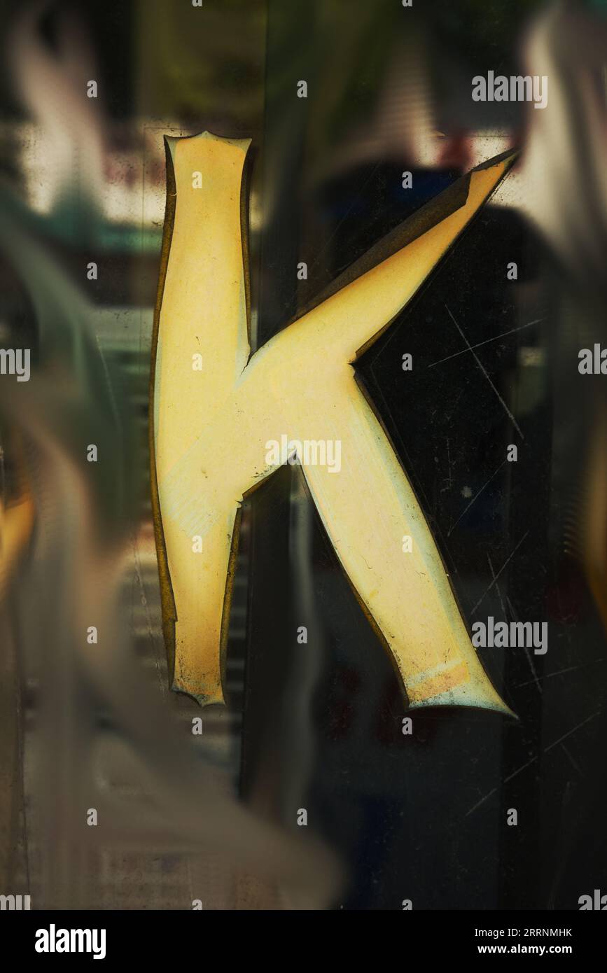 Old worn letter k, showing its age, pattern, lines and boldly grabbing attention.  Be noticed with this single letter, Stock Photo