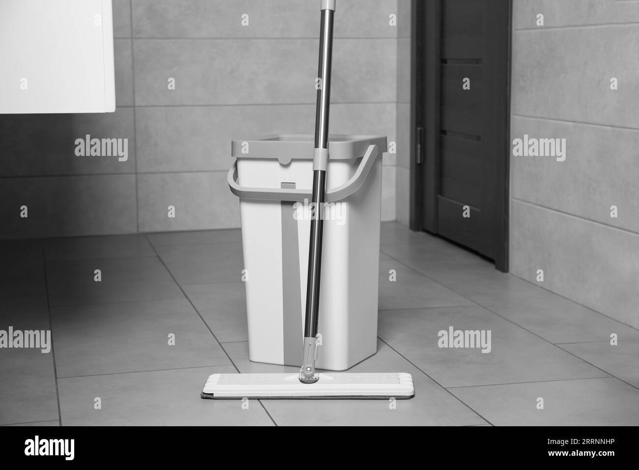 White mop and bucket in public toilet Stock Photo Alamy