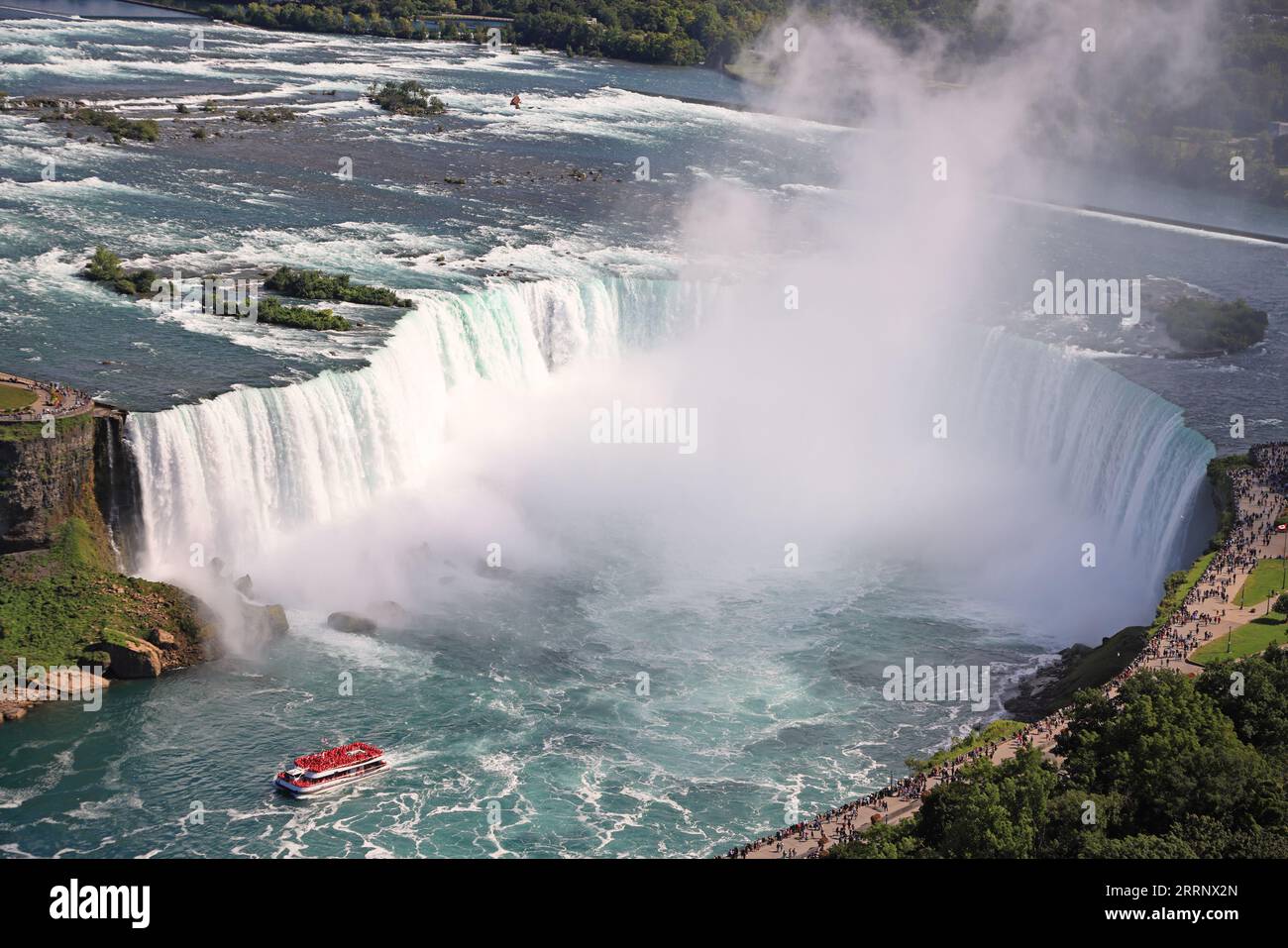 Aerial view of Horseshoe Falls including Hornblower Boat sailing on Niagara River, Canada and USA natural border Stock Photo
