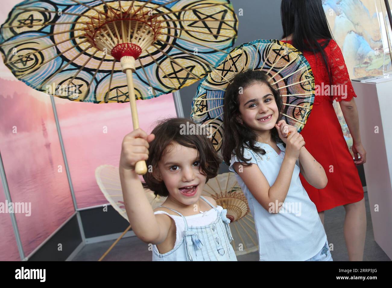 Brussels, Belgium. 8th Sep, 2023. Young girls visit the Chinese Pavilion at the Brussels Comic Strip Festival in Brussels, Belgium, on Sept. 8, 2023. The Chinese Pavilion opened its exhibition to the public on Friday during the Brussels Comic Strip Festival from Sept. 8 to 10. Besides comics from China, the Chinese Pavilion also presents Belgian and European comic strip enthusiasts with around ten traditional Chinese craft techniques, such as Tang dynasty pottery, Erhu, pipa and Huimo ink making, with the art of comic books. Credit: Zhao Dingzhe/Xinhua/Alamy Live News Stock Photo