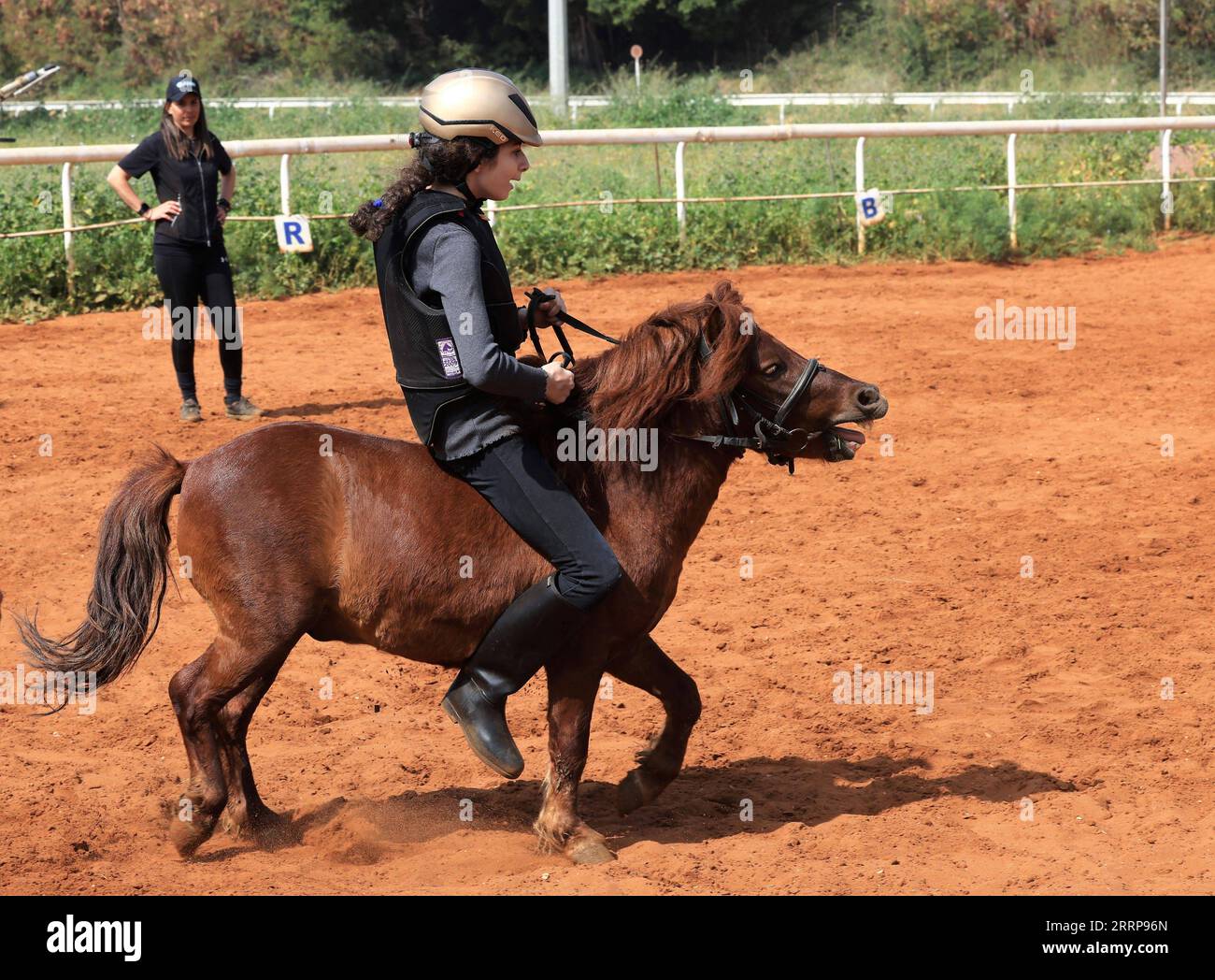 230305 BEIRUT, March 5, 2023 A girl rides a horse during a horse