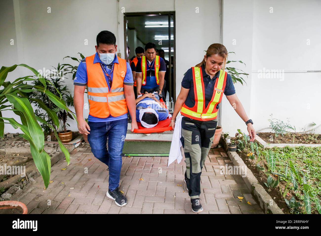 Philippine Rescuer Model 230309 -- QUEZON CITY, March 9, 2023 -- Rescuers carry a mock victim ...