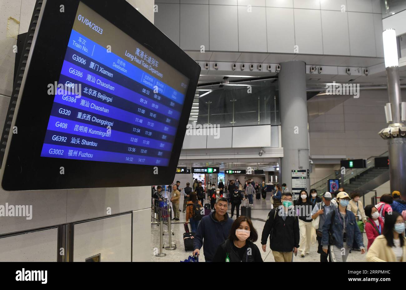 230401 -- HONG KONG, April 1, 2023 -- Passengers arrive at the departure hall of the West Kowloon Station in south China s Hong Kong, April 1, 2023. The long-haul services of the Express Rail Link XRL Hong Kong Section fully resumed on Saturday, connecting the financial hub with destinations outside the neighboring Guangdong province. TO GO WITH High-speed railway services between Hong Kong, mainland fully resume  CHINA-HONG KONG-HIGH-SPEED RAILWAY-MAINLAND-RESUMPTION CN ChenxDuo PUBLICATIONxNOTxINxCHN Stock Photo